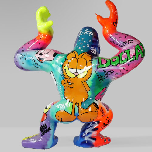 Colorful sculpture with graffiti art featuring cartoon characters and words like 