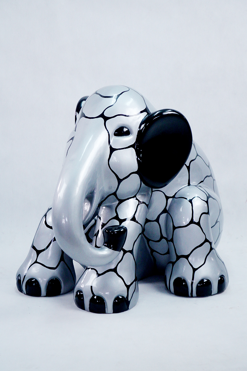 Sitting Elephant L - Silver Patches 1 Silver elephant figurine with black ears, black feet, and a network of black lines on its body.