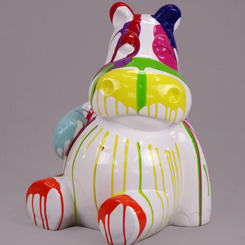 Colorful abstract hippo sculpture with dripping paint in shades of blue, red, green, yellow, and purple.