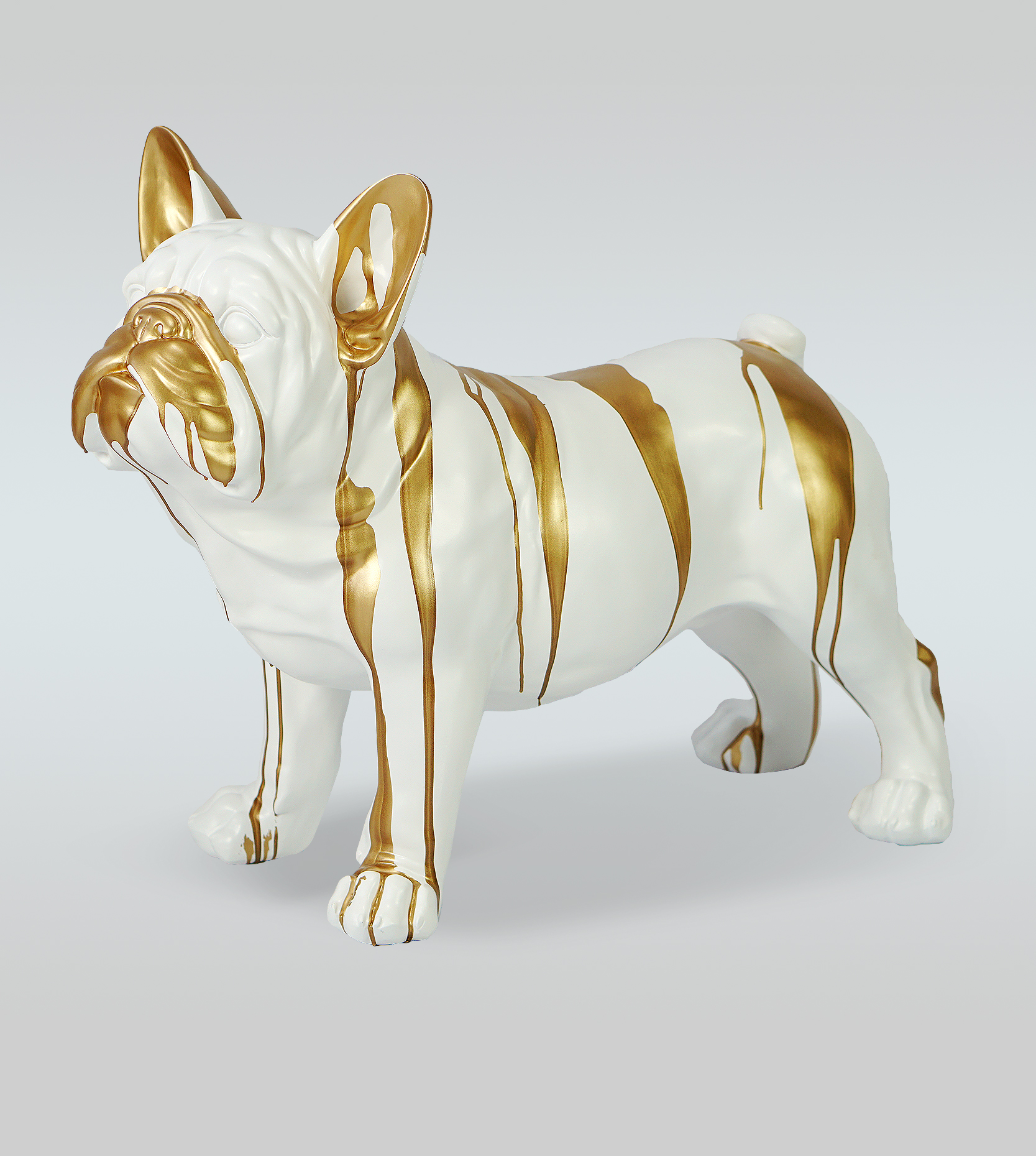 Dog Juki L - standing white trash bin 1 White ceramic bulldog sculpture with gold paint drips.