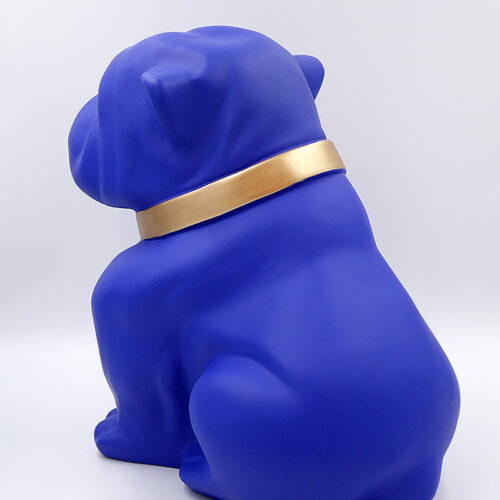 Blue bulldog statue wearing a gold collar, viewed from the back.