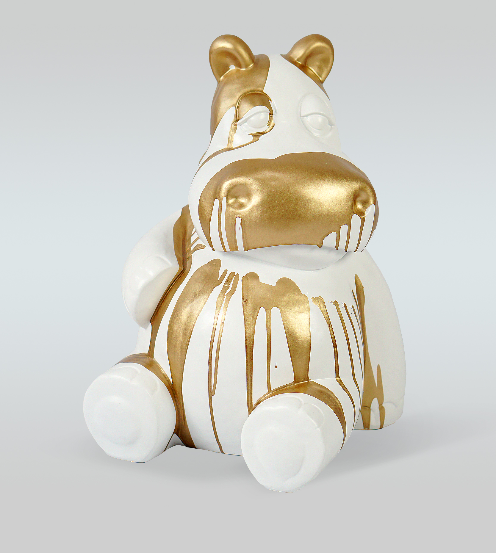White Hippo 40cm - golden trash 1 White ceramic hippo figure with gold paint dripped over it.