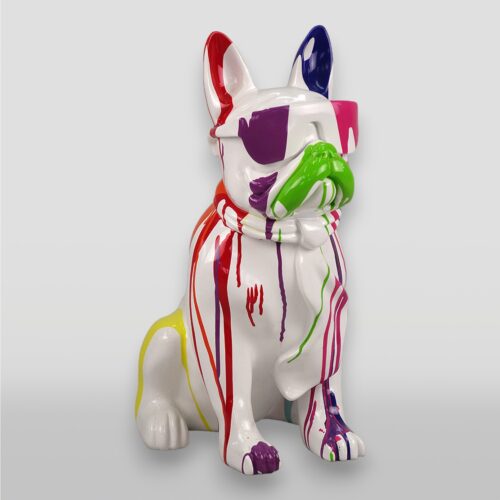 A white ceramic French Bulldog statue with colorful paint splashes and drips in red, purple, green, and yellow.