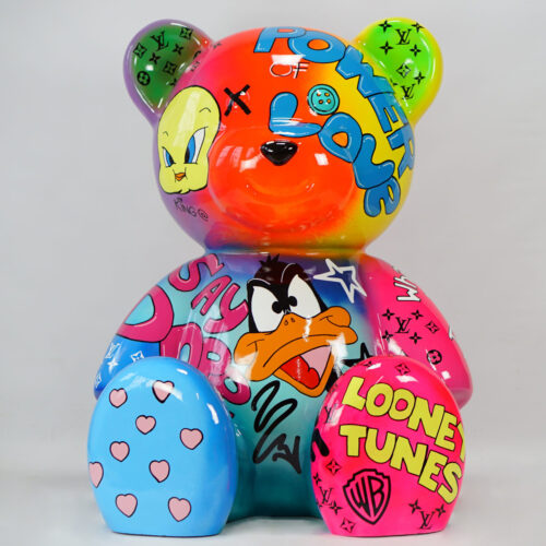 Multicolored bear sculpture featuring cartoon characters and text, including 