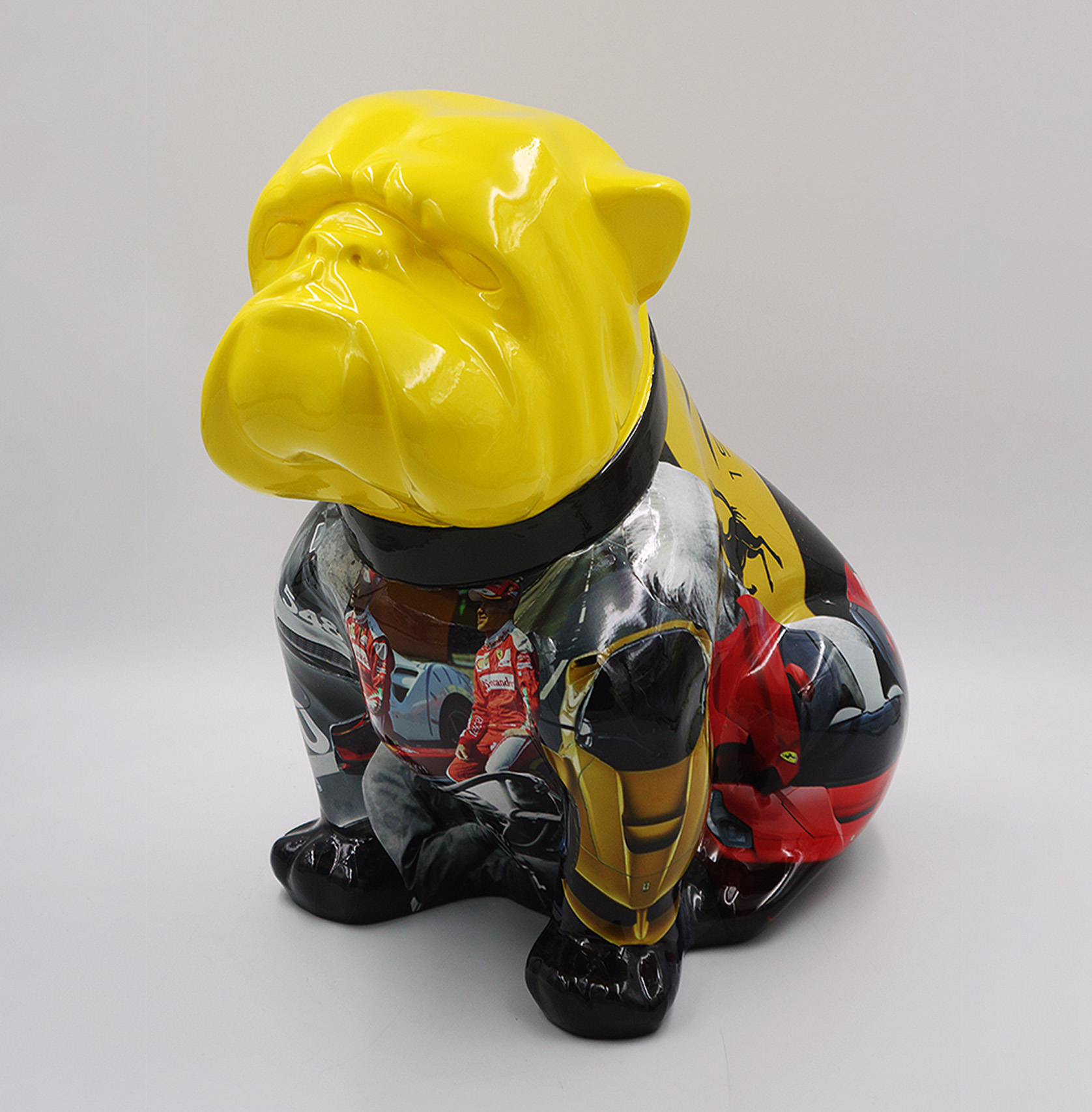 Bulldog Angelo 60cm dog - Ferrari 1 Colorful bulldog sculpture with a yellow head and a body featuring various painted figurative designs.