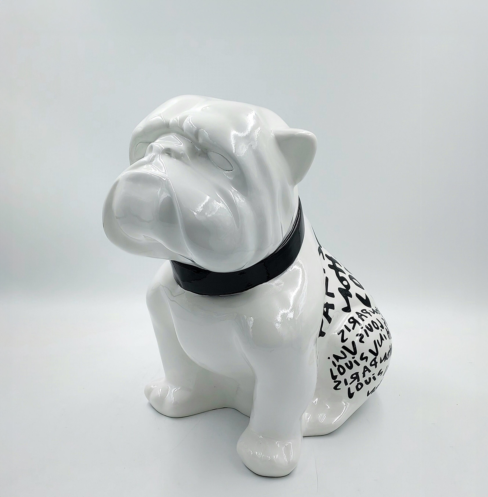Bulldog Angelo 40cm dog - Louis Paris 1 White ceramic bulldog figurine with black collar and letters on its back.