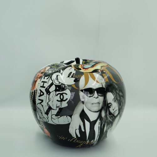Decorative apple with collage of fashion-related images and characters.