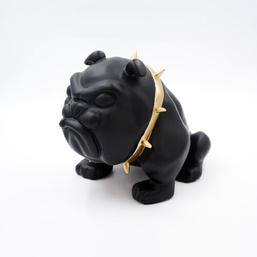 Black bulldog statue with a gold spiked collar on a white background.