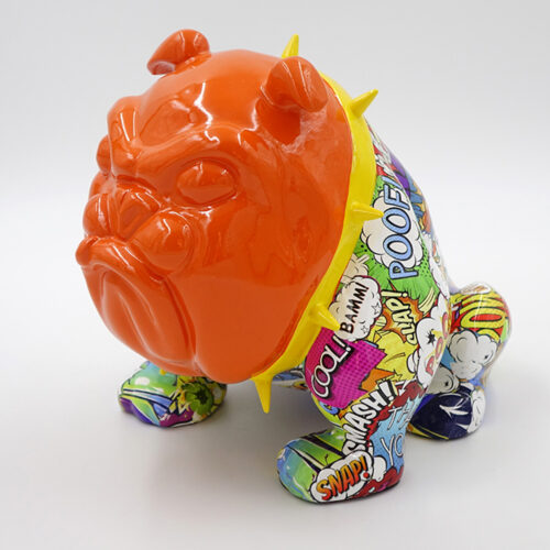 A brightly colored sculpture of a bulldog with an orange head and a body covered in various comic book-style words and graphics.