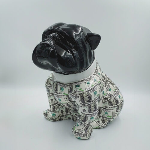 Black ceramic dog sculpture covered with $100 bills.