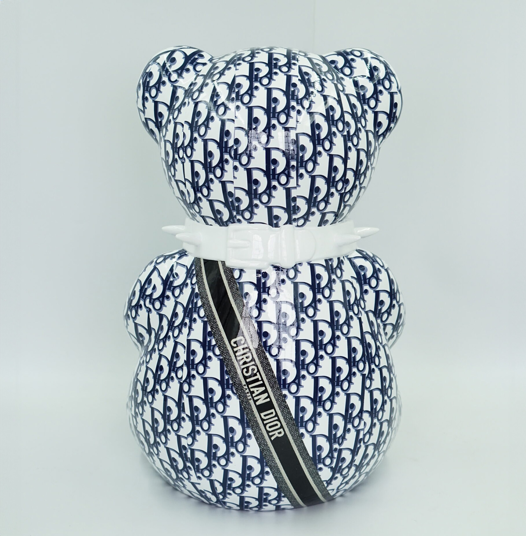 Bear CD H-45cm 2 I don't see any text written in Polish in the image. The visible text on the item says