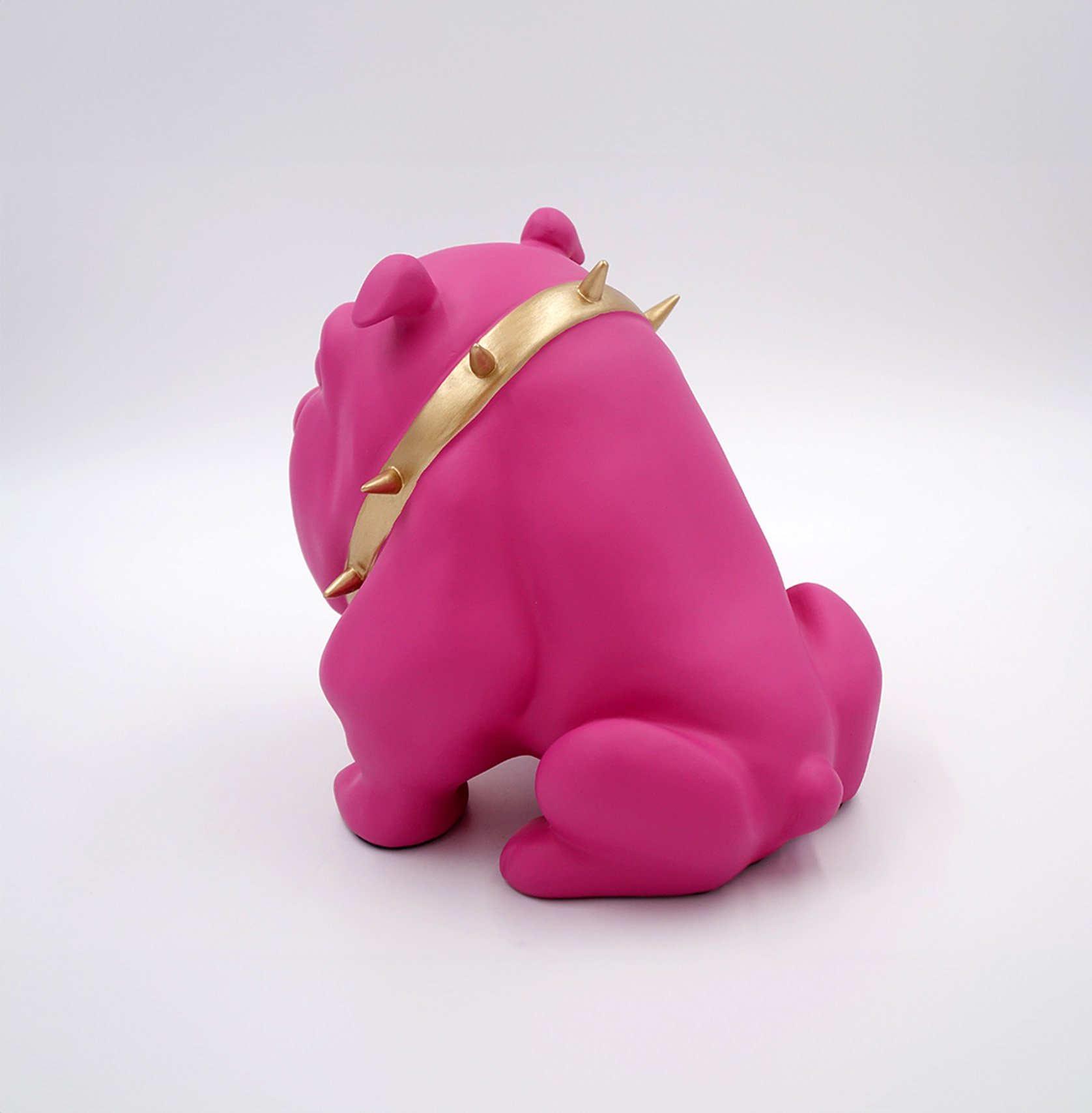 Dog Bulldog Avella 22cm - Matte Pink 2 Pink bulldog figurine with a gold spiked collar facing away.