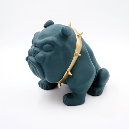 A dark teal bulldog sculpture with a gold spiked collar.