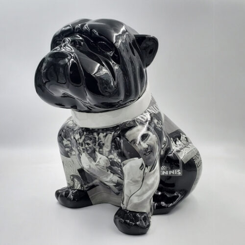 Black ceramic bulldog sculpture with images of tennis players.