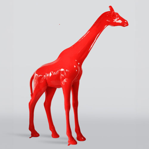 Red giraffe sculpture on a light gray background.