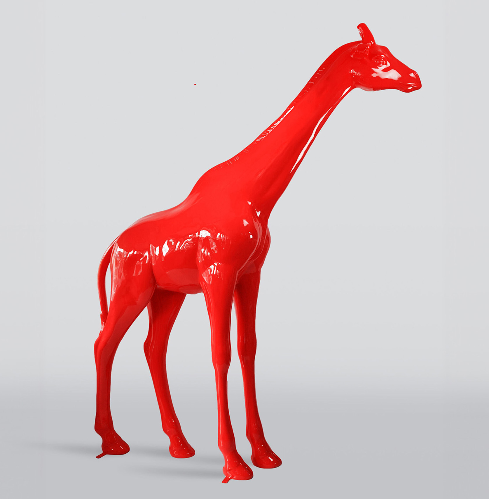 Large life-size giraffe figure - white 4 Red giraffe sculpture on a light gray background.