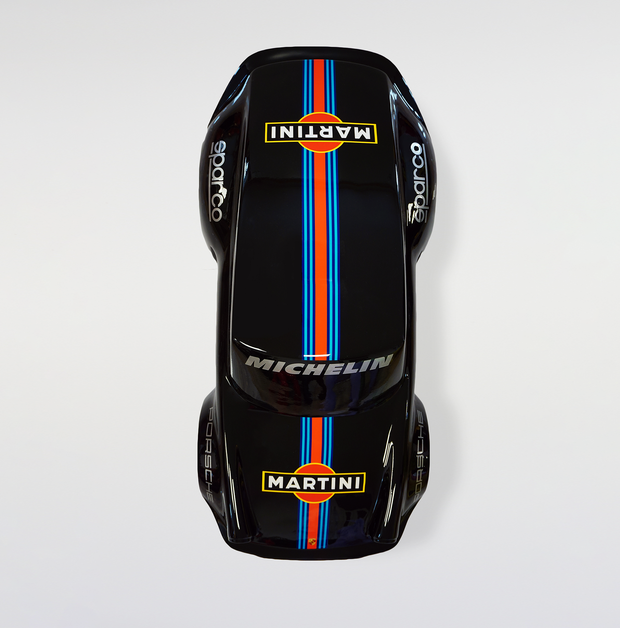 Car model 911 - motif 47 black 3 Top view of a black toy race car with Martini and Michelin branding.