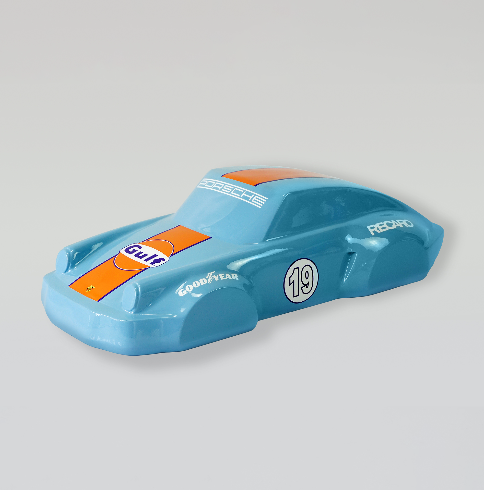Car model 911 - Motif 19 1 Blue toy race car with orange stripes and sponsor logos, including Gulf.