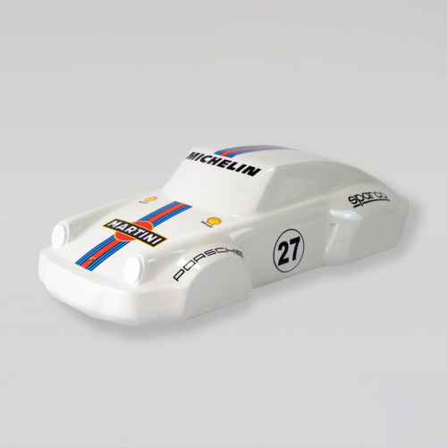 White toy car with Martini racing livery, featuring the number 27, and sponsor logos including Michelin and Shell.