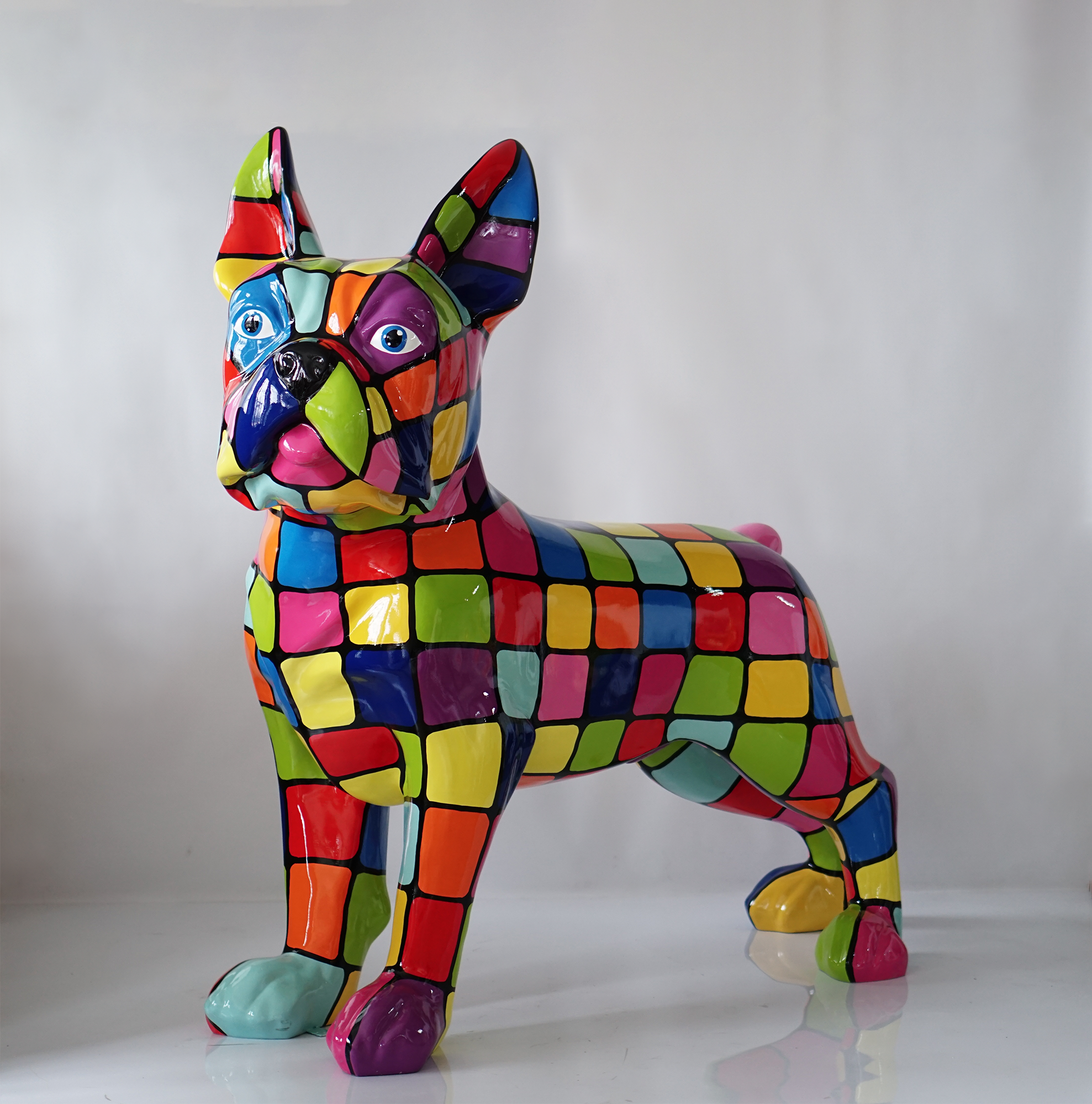 Large figure of a French Bulldog 1 Colorful mosaic French Bulldog sculpture with multicolored squares on a glossy surface.