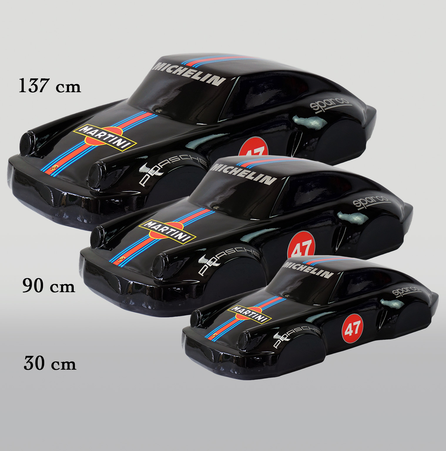 Car model 911 - motif 47 black 2 Three black toy cars with blue and red stripes, labeled