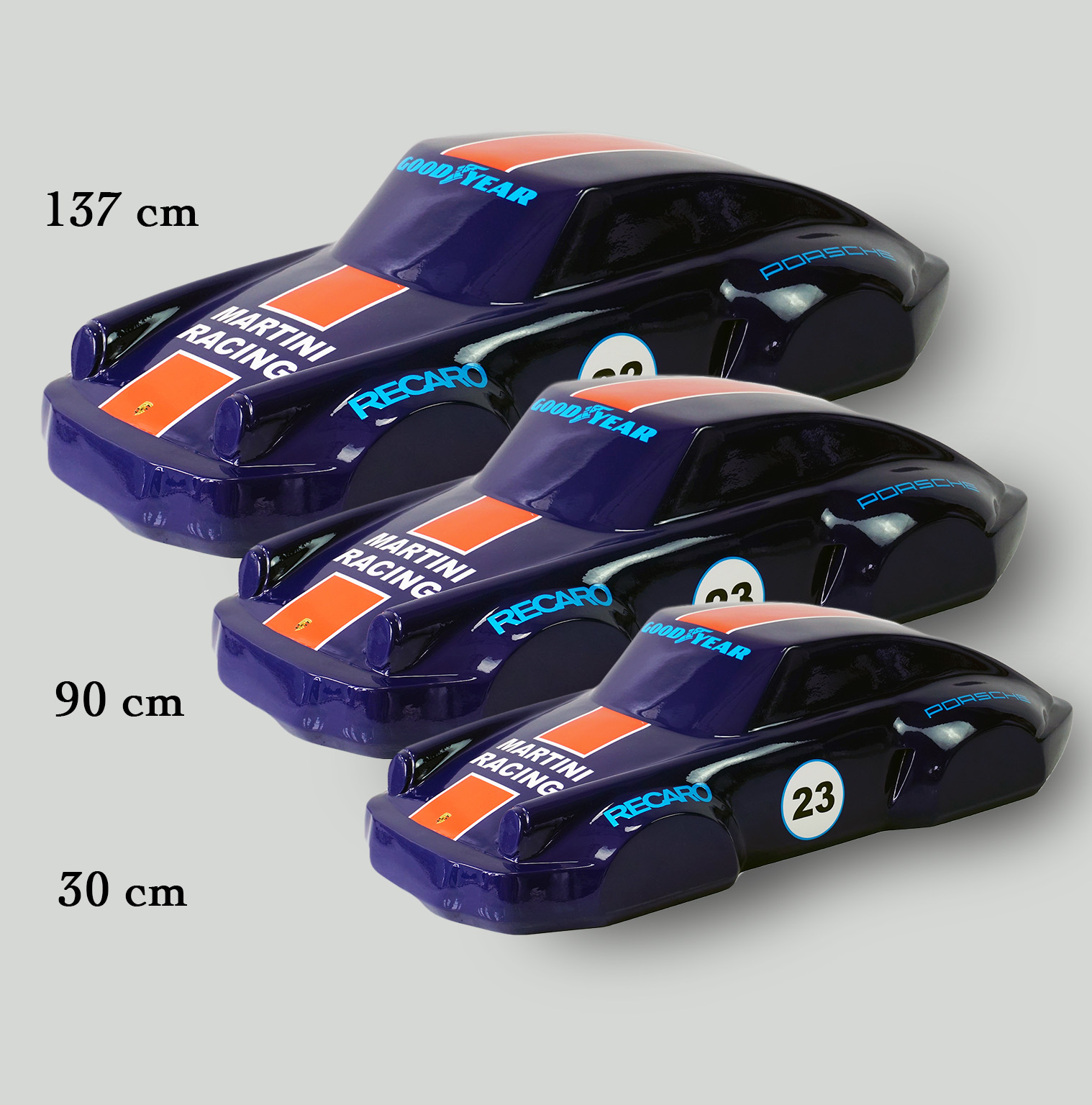 Car model 911 - motif 23 2 Three blue and orange toy race cars in different sizes with text displaying