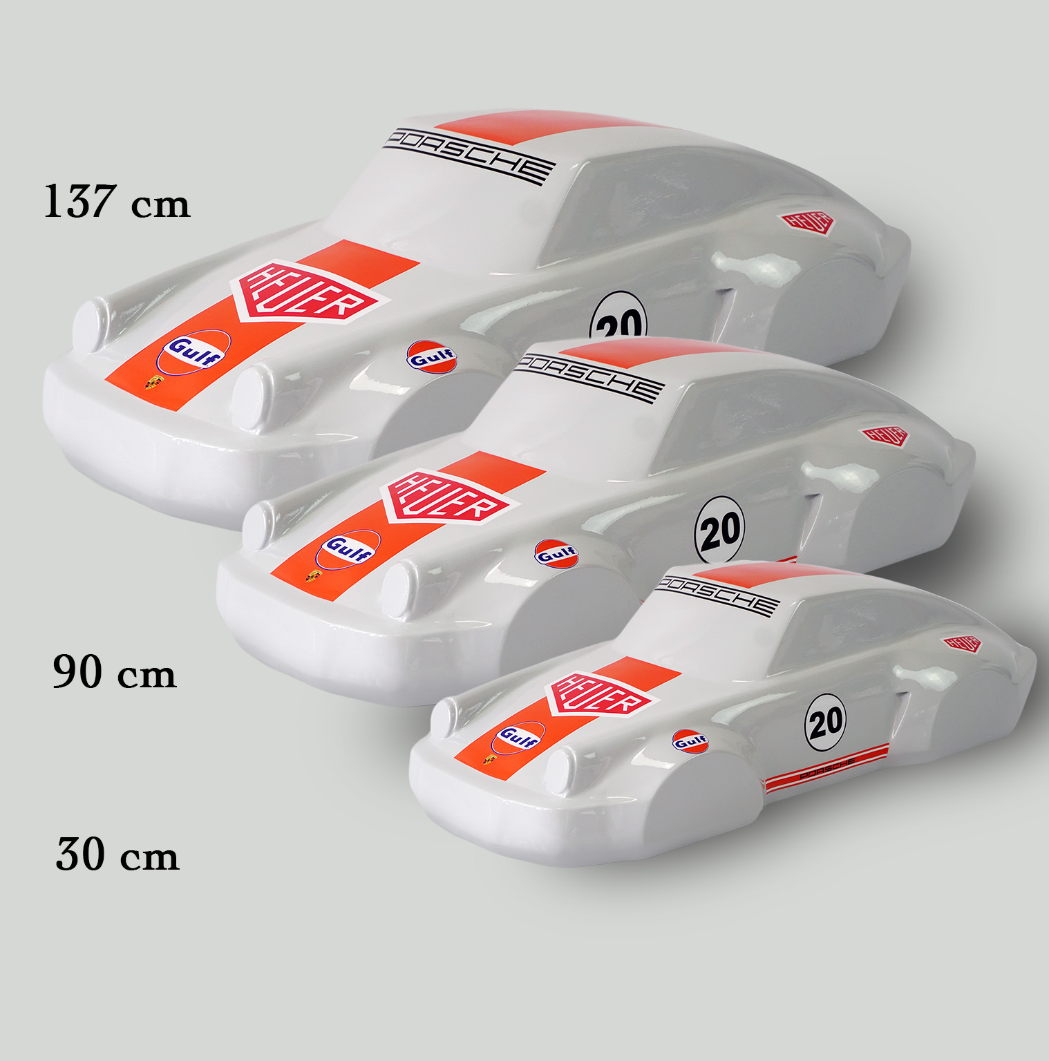 Car model 911 - motif 20 2 Three white model cars with red and blue racing decals labeled