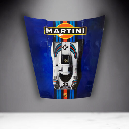 Hood of a car painted in blue with a Martini Racing livery design featuring a racing car and logos.