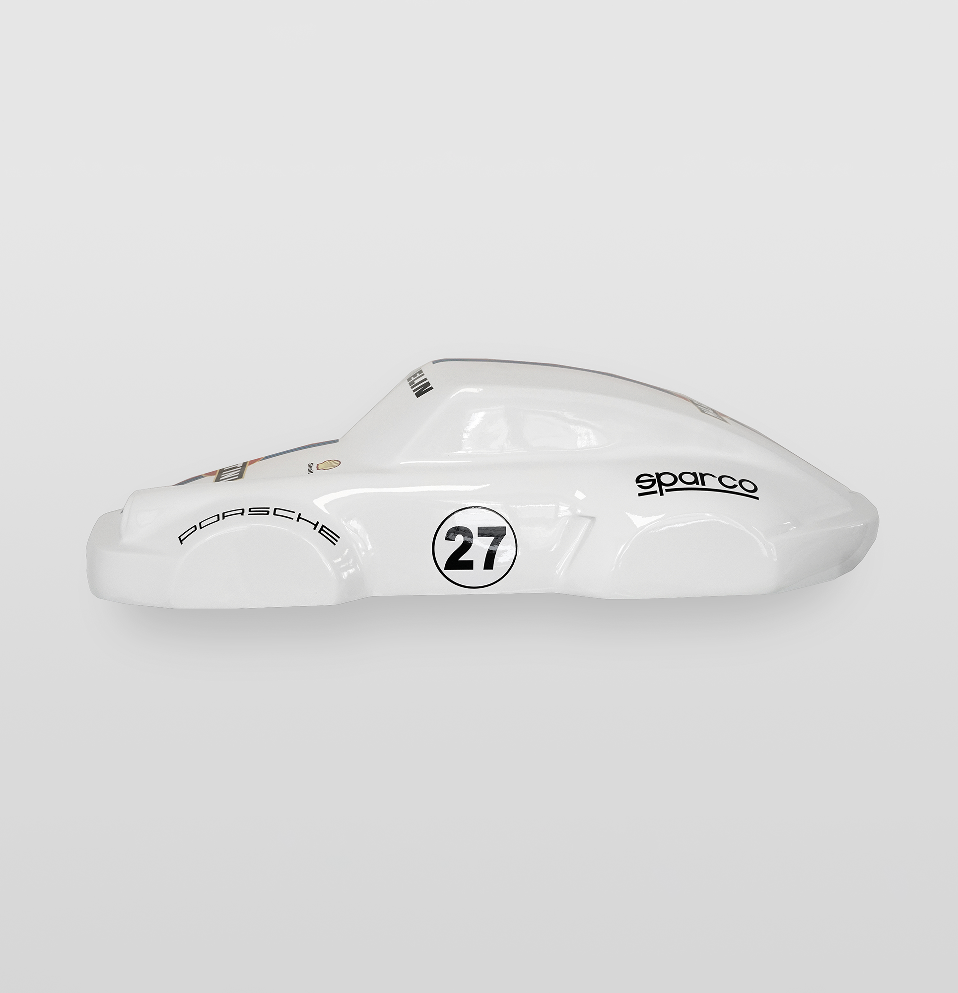 Car model 911 - Motif 27 - Half model 1 White model racing car with the number 27 and logos for Porsche and Sparco on a gray background.