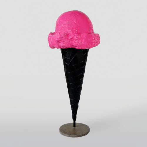 Pink ice cream on a black cone displayed on a stand.