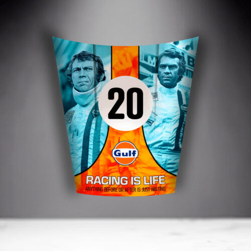 A racing-themed poster featuring two men in racing suits, centered around the number 20 and the Gulf logo. The text at the bottom reads 