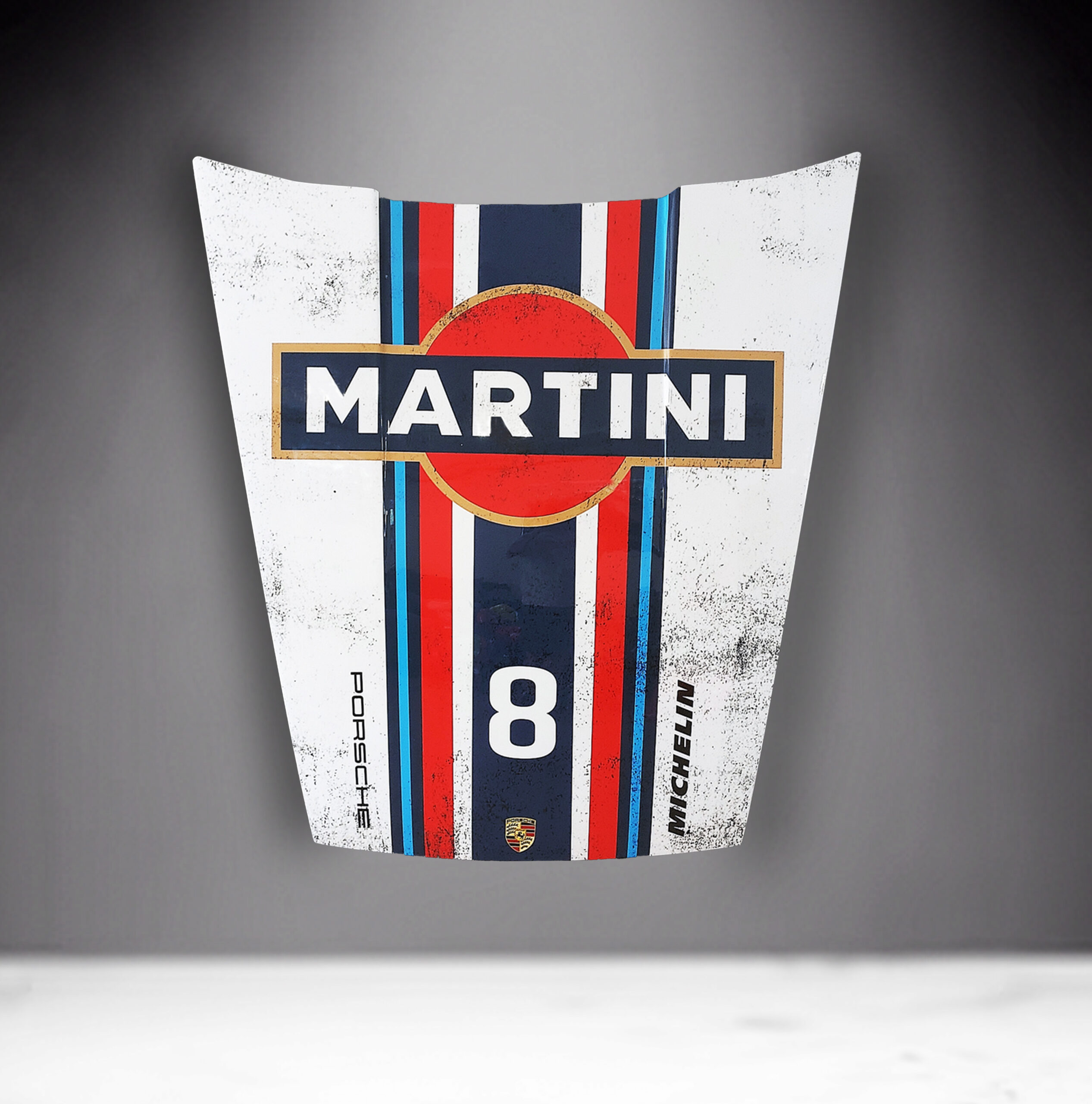 Car Mask 911 - Theme 35 2 A car hood with Martini branding, featuring a red circle with a black background and white text. The hood is also adorned with blue, red, and white racing stripes, the number 8, and logos for Porsche and Michelin.