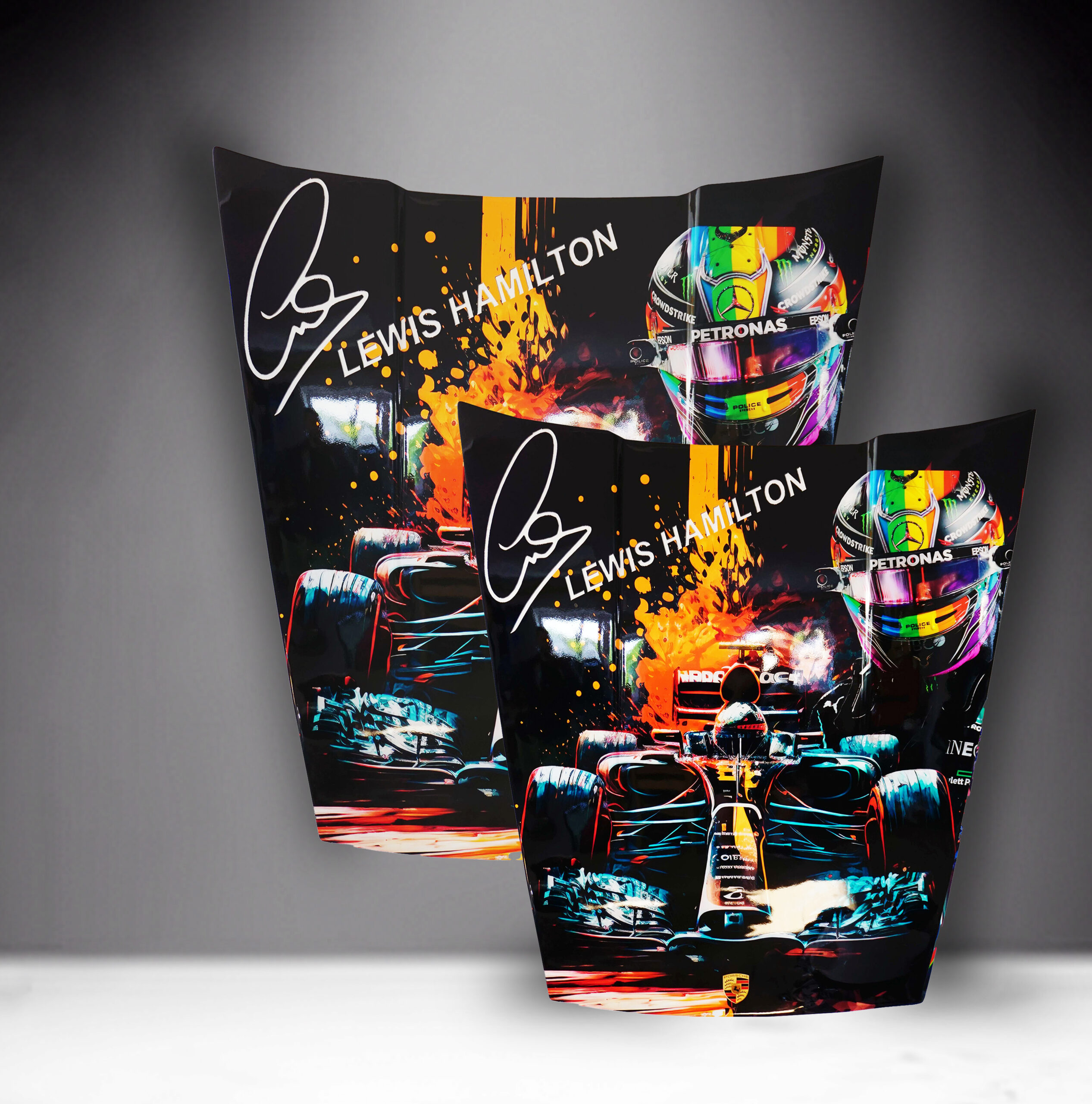 Car Mask 911 - Theme 20 1 Two racing posters featuring Lewis Hamilton, with his signature, a colorful racing helmet, and an image of his race car with fiery graphic elements.