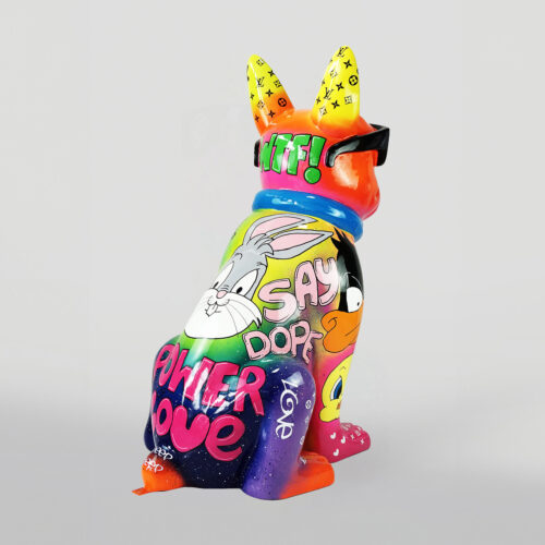 Colorful rabbit sculpture with cartoon characters and graffiti-like text, including the phrases 
