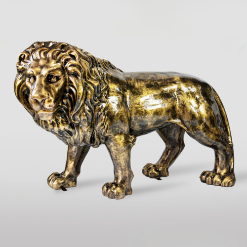 A shiny bronze sculpture of a lion.