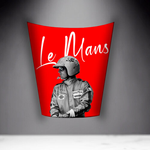 A red poster featuring a racing driver in black and white, with the text 