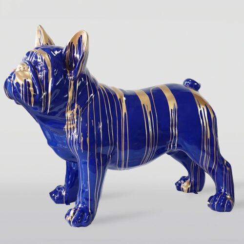 Statue of a blue French Bulldog with gold paint drips.