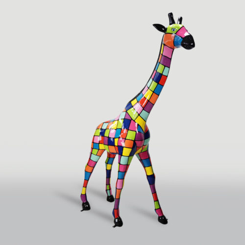 A colorful giraffe statue with a patchwork pattern of various bright colors including red, yellow, green, blue, and pink.