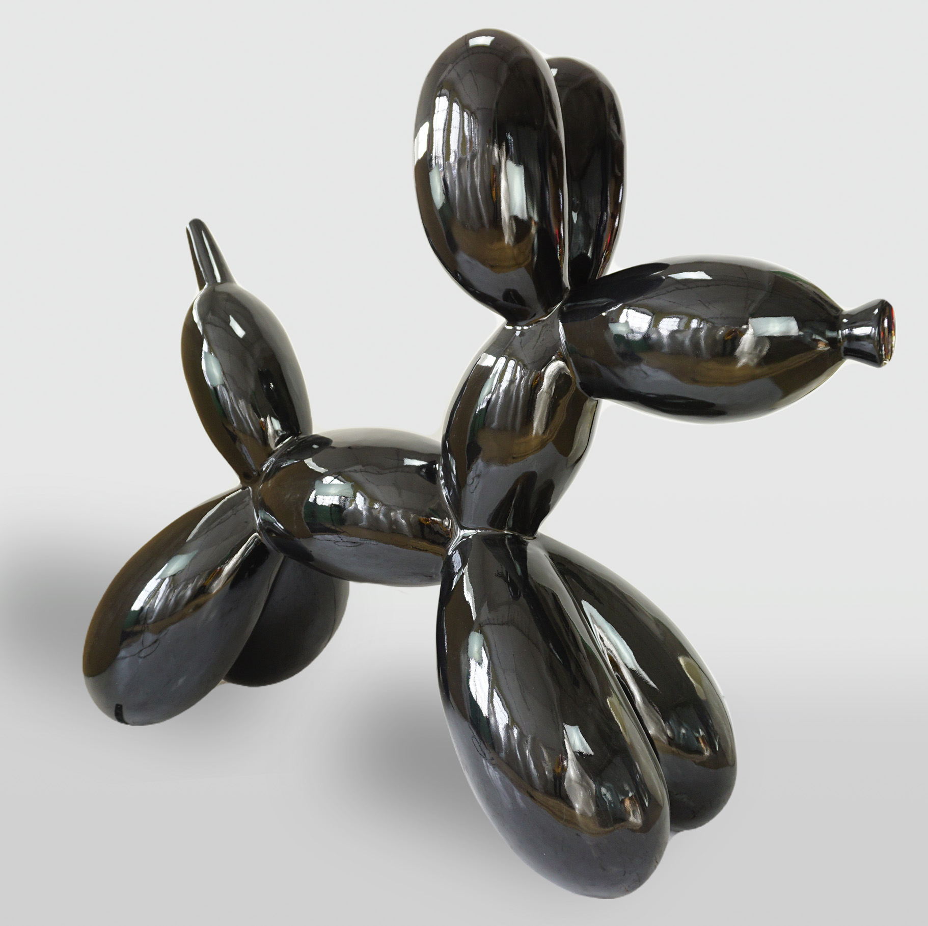 Balloon Dog - Large Decorative Figure - Black 1 A shiny black sculpture of a balloon dog, reflecting light on its surface.