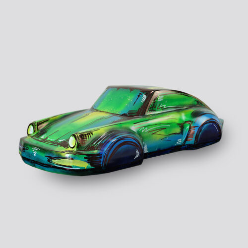 Green and blue stylized toy car on a light gray background.