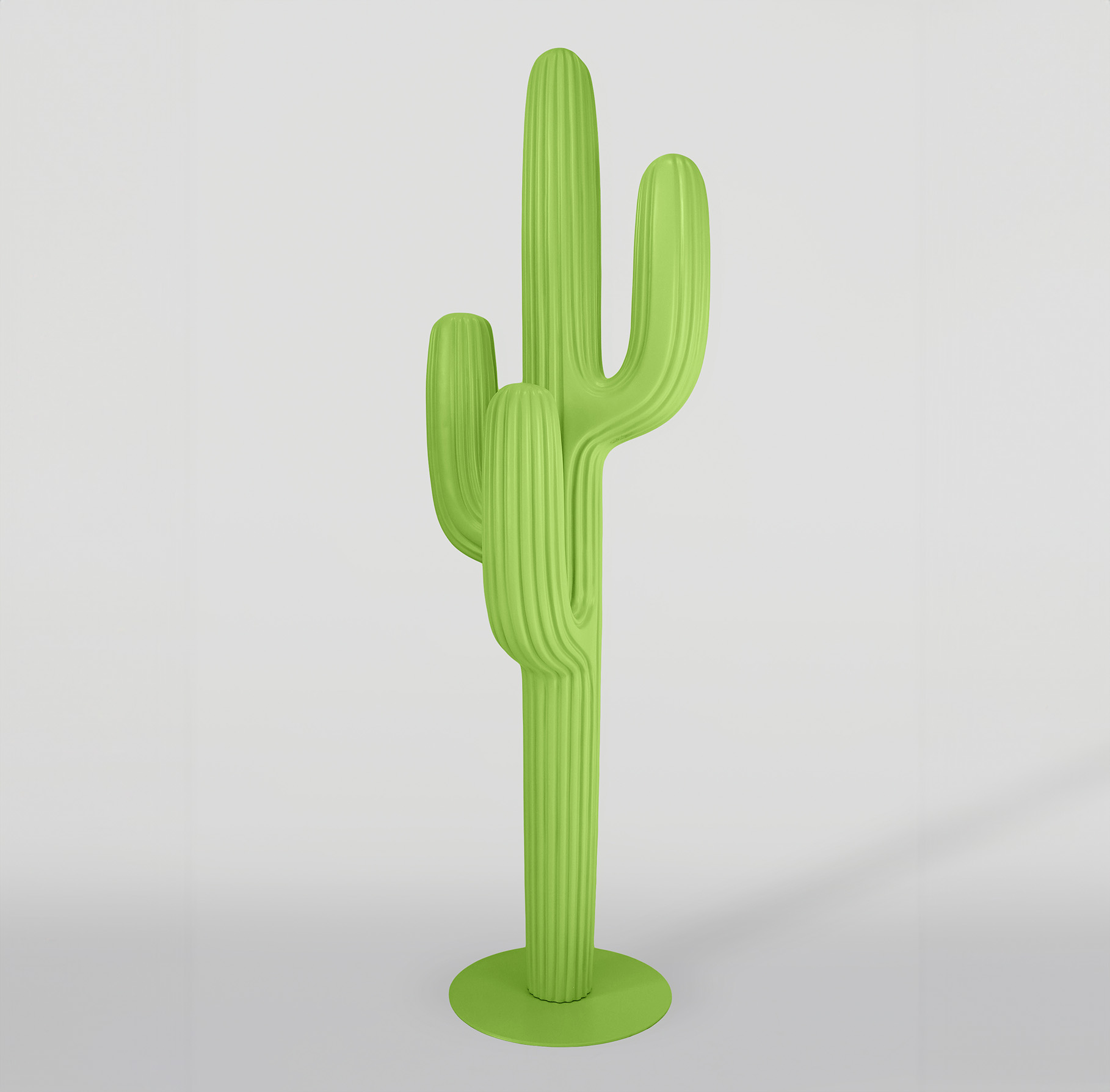 Pastel green hanger - cactus 1 A green, abstract cactus sculpture with a circular base in a minimalist setting.