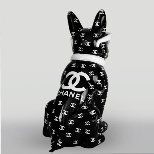 Black ceramic dog statue with white sunglasses and a white collar, covered in a pattern of white Chanel logos.