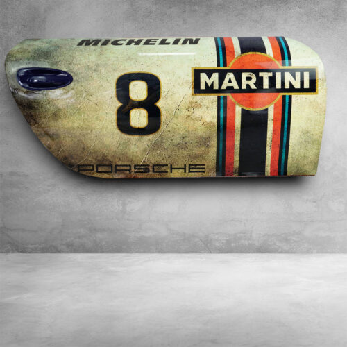 A vintage car door with racing decals, featuring the number 8, 