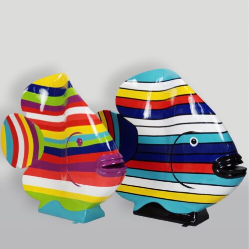 Two colorful fish sculptures with horizontal, multicolored stripes against a light gray background.