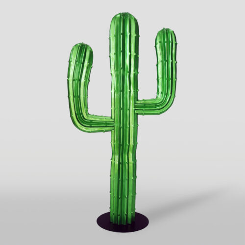 A green cactus sculpture with three arms on a black circular base against a light gray background.