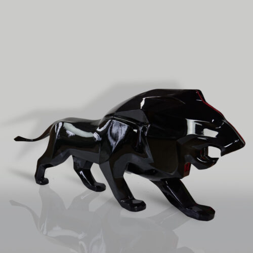 Glossy black lion sculpture with an angular, geometric design on a reflective surface.