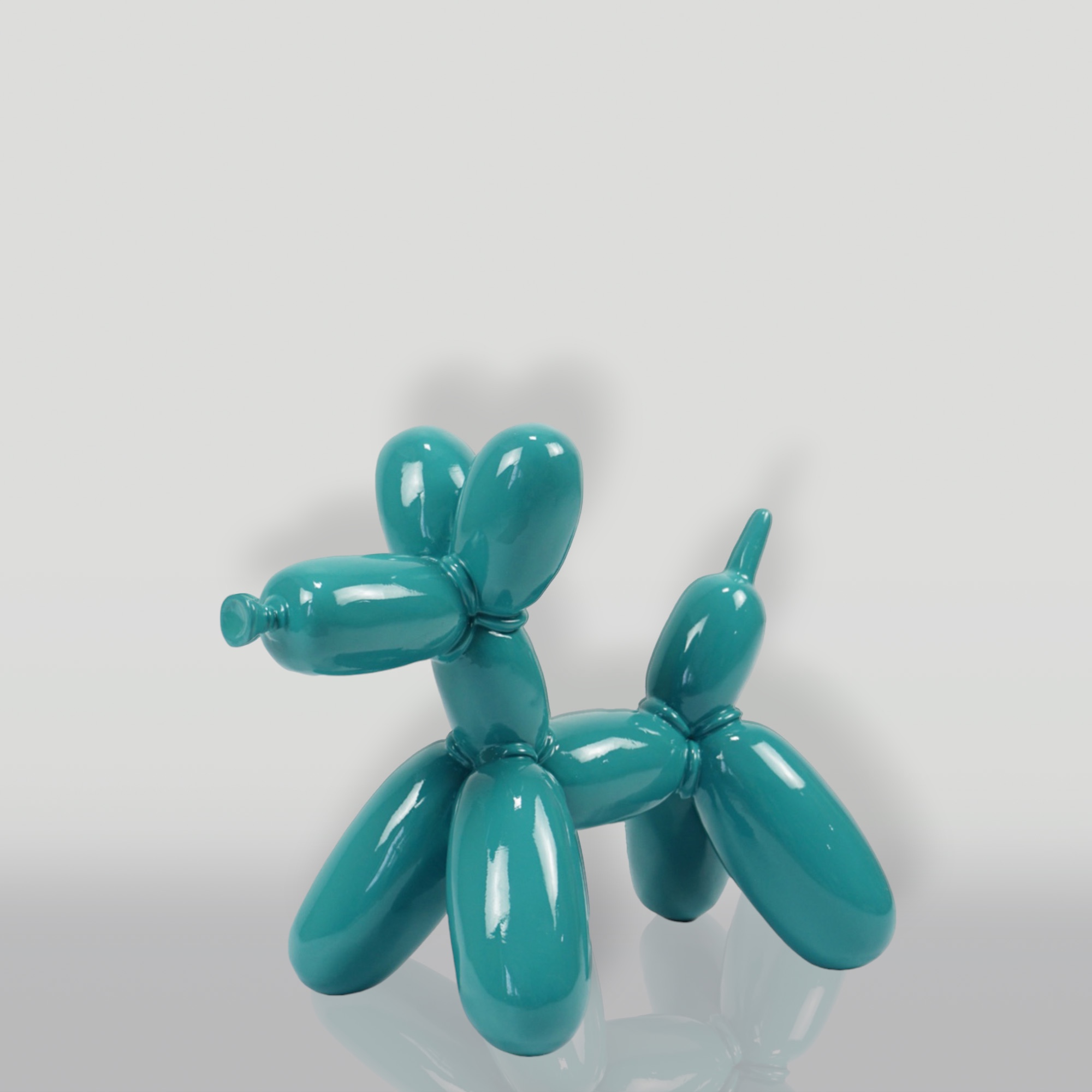 Balloon Dog Small Decorative Figure - Turquoise 1 Turquoise balloon dog sculpture against a plain background.