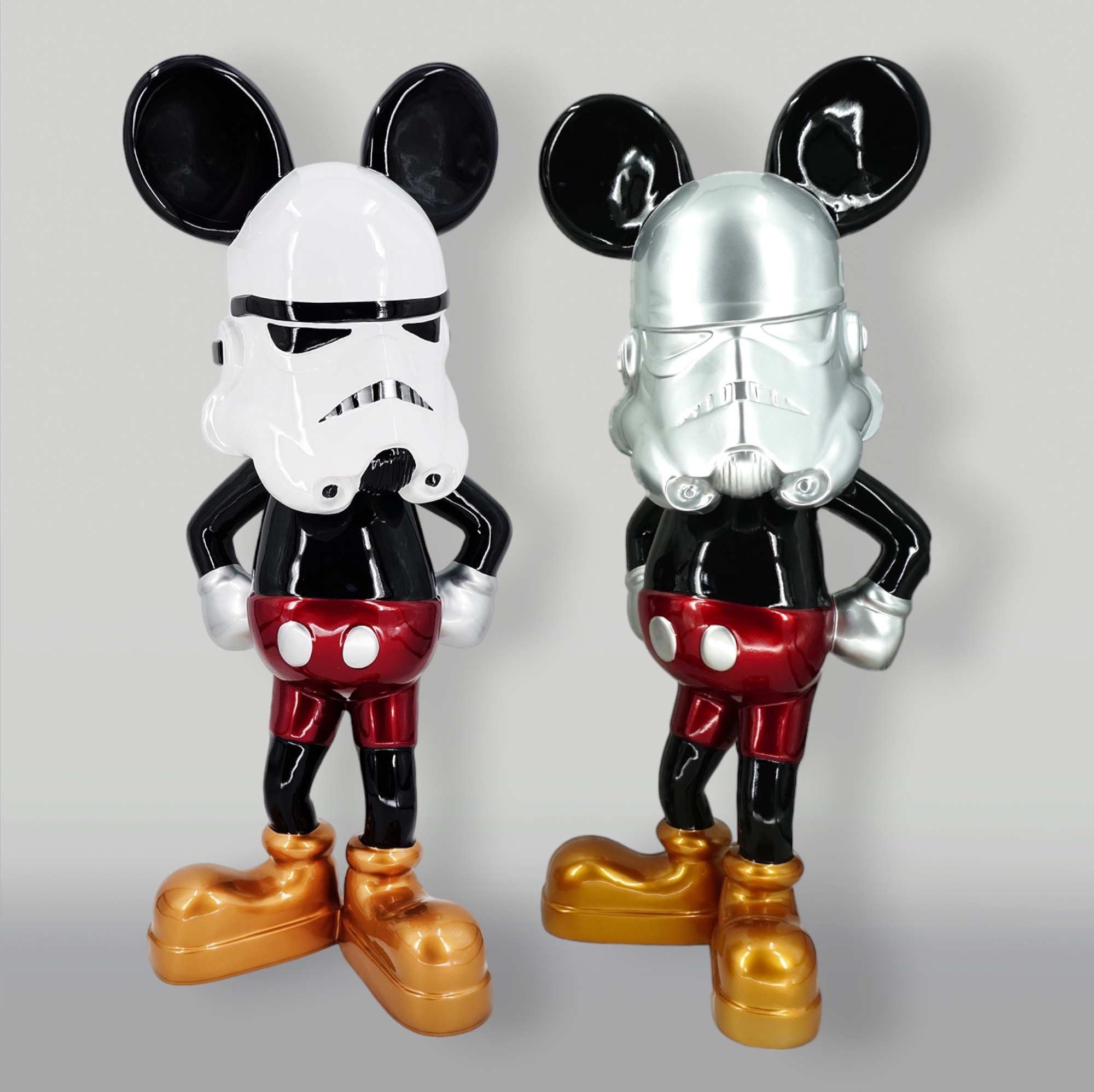 Decorative Figure White Stormtrooper Mouse 2 Two figurines resembling a mix of Mickey Mouse and Stormtroopers, wearing black and red outfits with golden shoes.