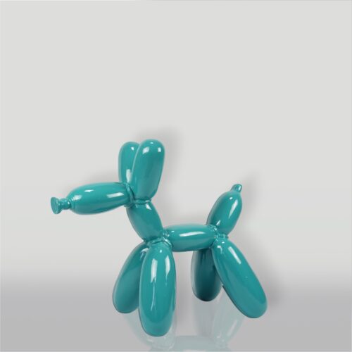 A teal balloon animal sculpture resembling a dog placed against a light background.