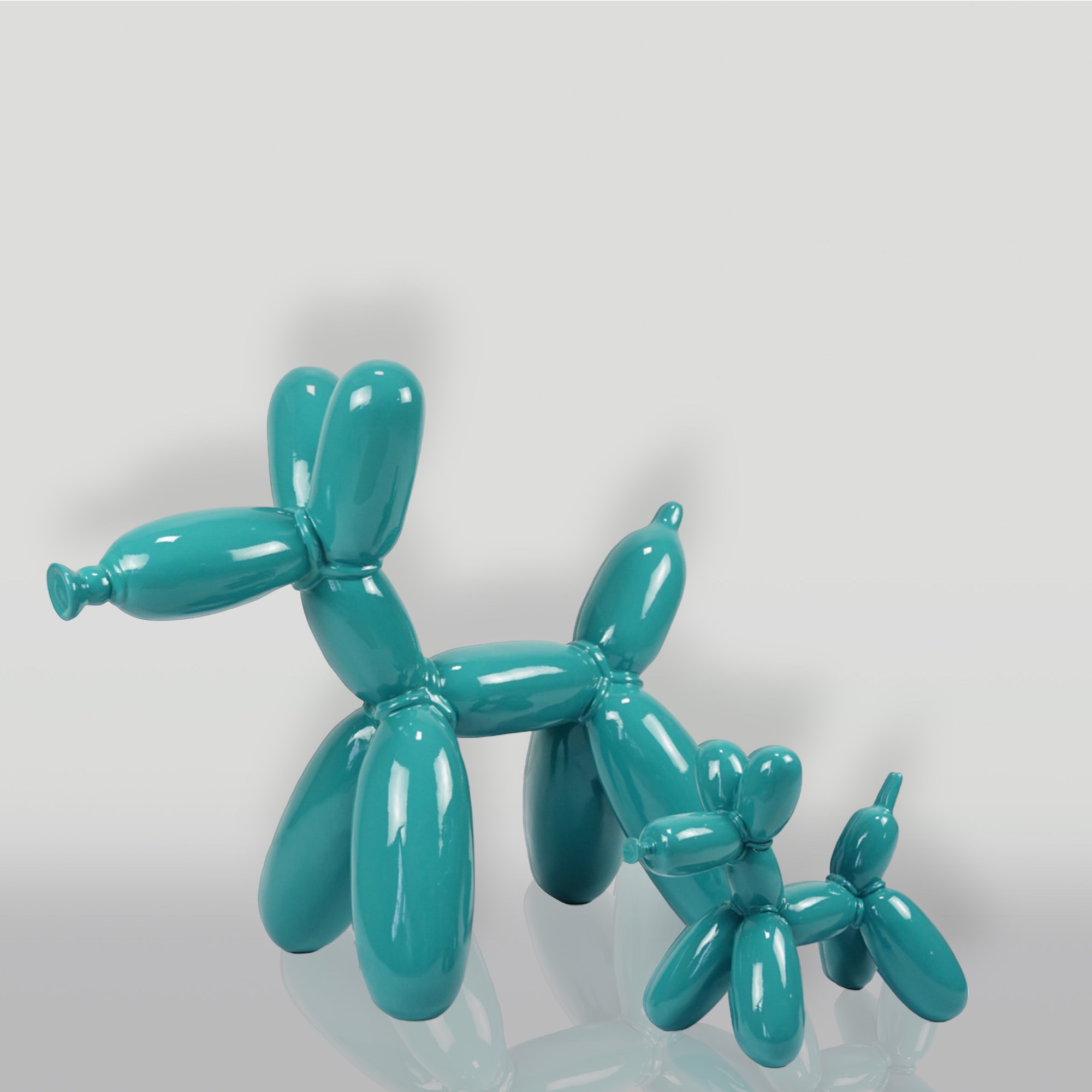 Balloon Dog Small Decorative Figure - Turquoise 2 Turquoise balloon sculptures of a large and small dog against a plain background.